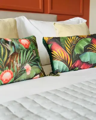 two pillows sitting on top of a bed at Meliora Suites in Drapaniás