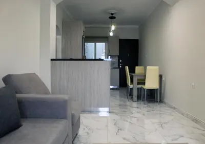 a living room with a couch and a table at Monica's Luxury Apartment in Chania Town