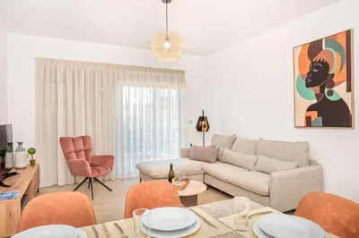 a living room with a couch and a table at Casa Kamara in Kounoupidhianá