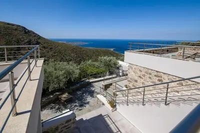 a view of the ocean from the balcony of a house at Vigla Apartments No.3 in AmigdhalokeFálion