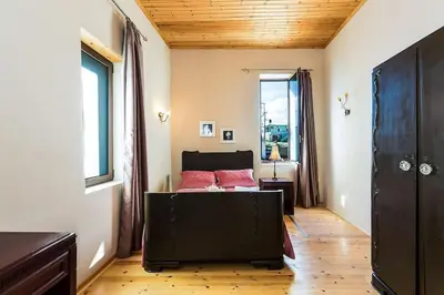 a bedroom with a bed and a window at Lefteris Holiday Home in Chania Town