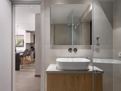 a bathroom with a white sink and a tub at Casa D'Irene Apts in Chania Town