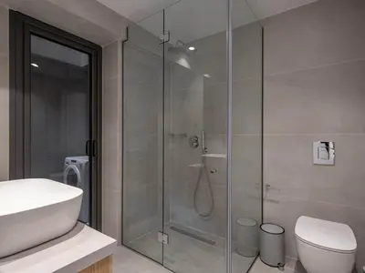 a bathroom with a shower with a toilet and a sink at Casa D'Irene Apts in Chania Town