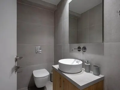 a bathroom with a sink and a toilet at Casa D'Irene Apts in Chania Town