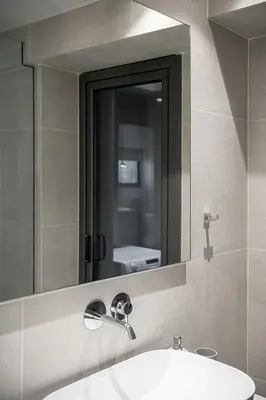 a bathroom with a sink and a mirror at Casa D'Irene Apts in Chania Town