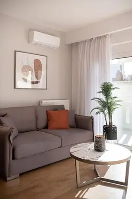 a living room with a couch and a table at Angelo Luxury Apartment in Chania Town