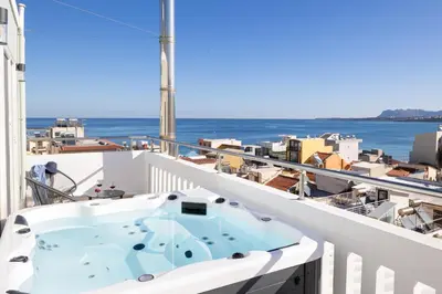 a hot tub on the balcony of a cruise ship at -Superior Maisonette Jacuzzi & Private Parking - Koum Kapi Mare Seaside in Chania Town
