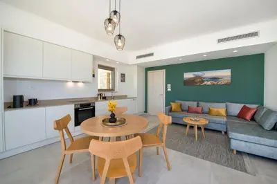a living room with a couch and a table at Christos Place-Paleochora in Palaiochóra