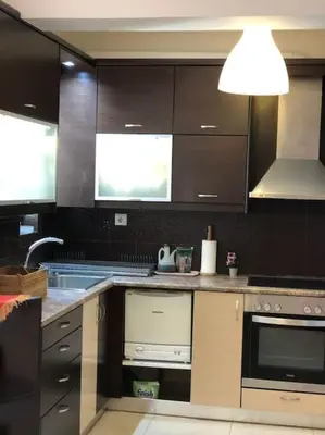 a kitchen with a sink and a stove top oven at Ariadni's apartment 1 in Chania Town