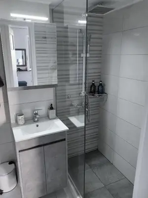 a bathroom with a shower and a sink at Capt73134 in Chania Town