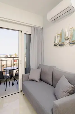 a living room with a couch and a table at EDEL Luxury Apartments in Chania Town