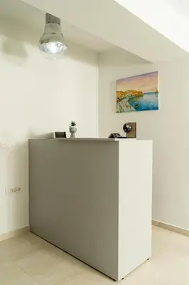 a white refrigerator in a room with a painting at EDEL Luxury Apartments in Chania Town
