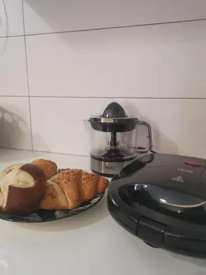 a plate of bread on a counter next to a food processor at Dimitras residence in Chania Town