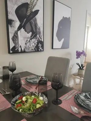 a table with a plate of food and a bowl of salad at Dimitras residence in Chania Town