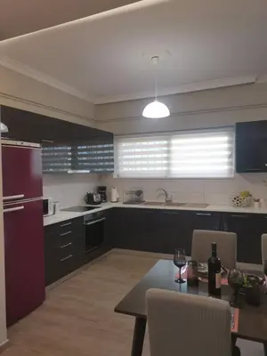 a kitchen with a table and a dining room at Dimitras residence in Chania Town