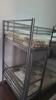 a bunk bed with a metal bunk bed frame at Angelina House in Chania Town