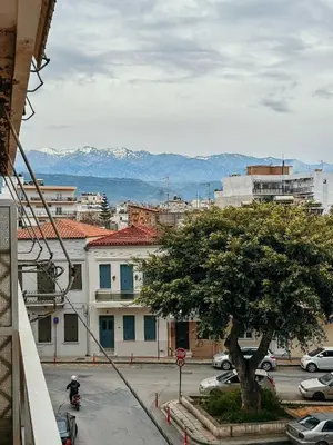 a city with a tree in a parking lot at Angelina House in Chania Town