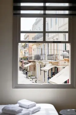 a window view of a city from a hotel room at The Botanist Rooms, Ritzou in Chania Town