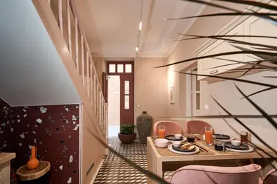 a dining room with a table and chairs at Elyn House in Chania Town