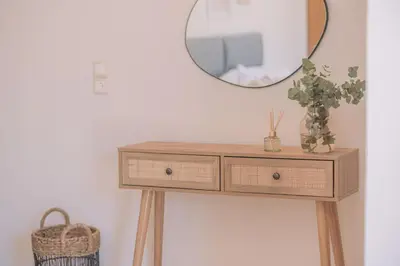 a dressing table with a mirror on top of it at Summer Blue Apartments Chania in Chania Town