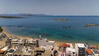 an aerial view of a beach with buildings and the water at Lazaretta apartment 2 in Chania Town