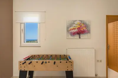 a wooden table in the corner of a room at Olive Tree Villa in Chania Town