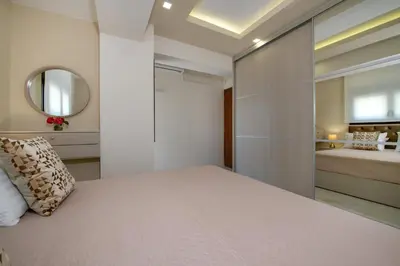 a bedroom with a bed and a mirror at Aretousa Home in Chania Town
