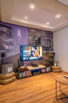 a living room with a large flat screen tv at Deja Blue Chania in Daratso