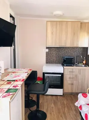 a small kitchen with a counter and a stove at Ariadni's apartment 3 in Chania Town