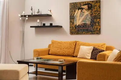 a living room with a couch and a table at Villa Androniki in Souda