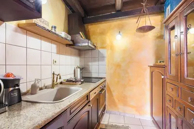 a kitchen with a sink and a counter top at Samonas - 5 maisonettes with breathtaking views in Chania Town