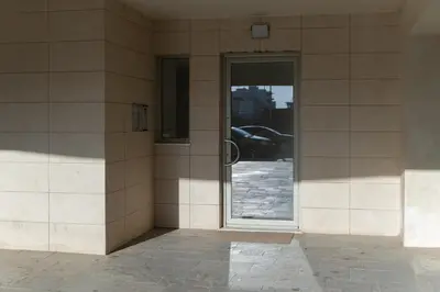 a door to a building with a window at Dejaview cozy apartment by 8essentially in Chania Town