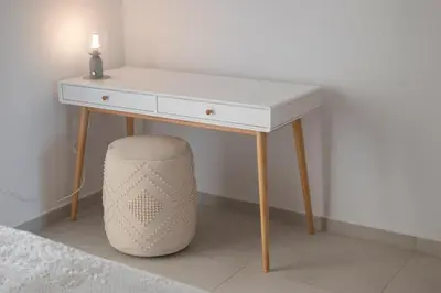 a white desk with a lamp on top of it at Elia Apartments in Falasarna