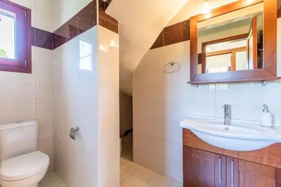a bathroom with a sink and a toilet at Gold Crest Home in Drapanias beach, Nopigia in Kissamos