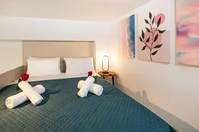 a bedroom with a bed with two stuffed animals on it at Ontas apartment in Kissamos in Kissamos