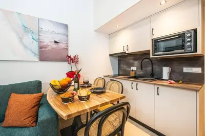 a small kitchen with a table and a counter top at Ontas apartment in Kissamos in Kissamos