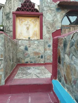 a stone building with a plaque on the wall at Kastania..2 in Kiolianá